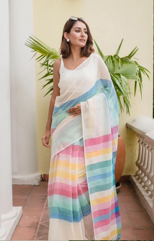 White linen cotton saree featuring a digital print pattern with an unstitched blouse piece