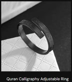 A close up view of a polished stainless steel band ring.