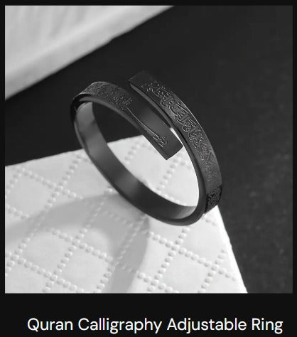 A close up view of a polished stainless steel band ring.