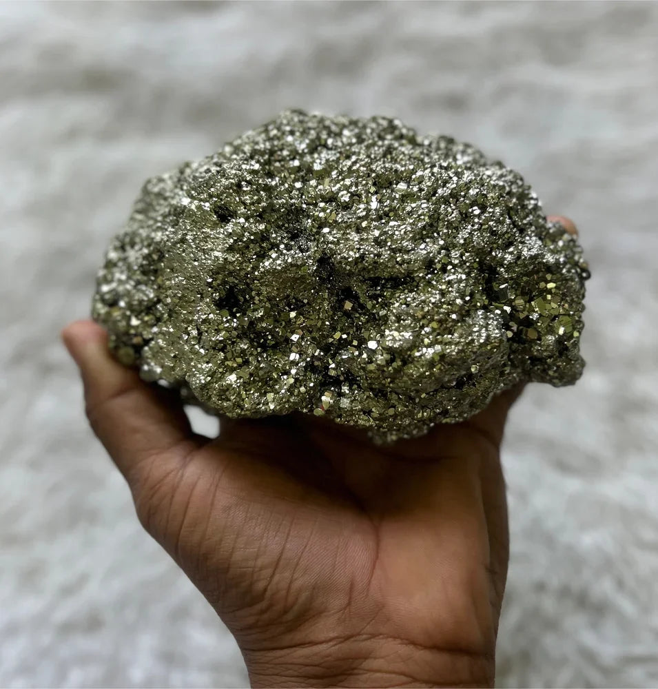 A natural BharatYug pyrite stone mineral specimen piece on a plain background