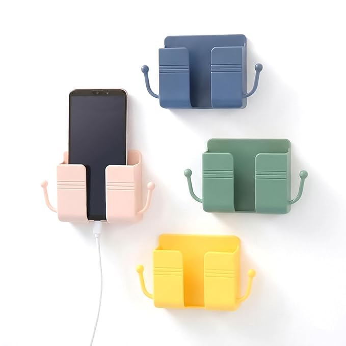 A white plastic wall mount storage holder for phones and remotes
