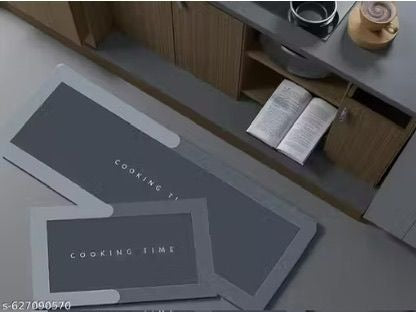 A set of two rectangular kitchen floor mats placed on a kitchen tile floor.