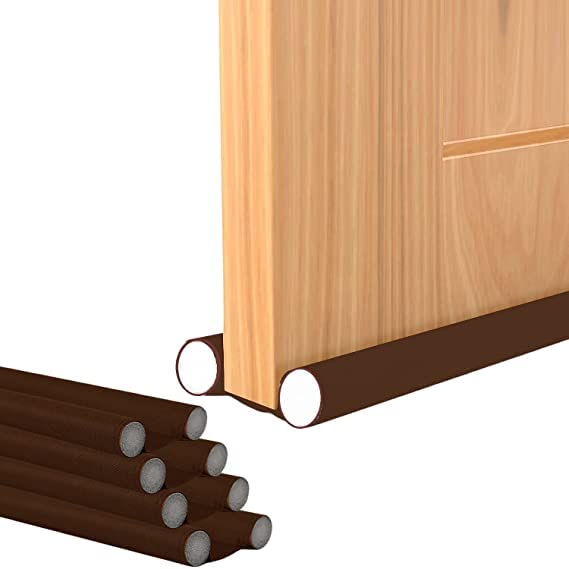 Twin-sided door bottom sealing strip with fabric sleeve and foam inserts