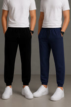 A pack of two dark blue and black cotton blend track pants folded