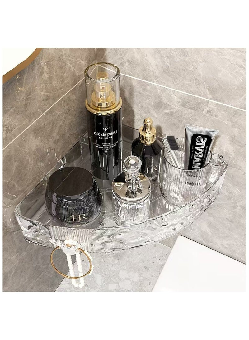 A metal corner shelf mounted to bathroom tiles holding shower products