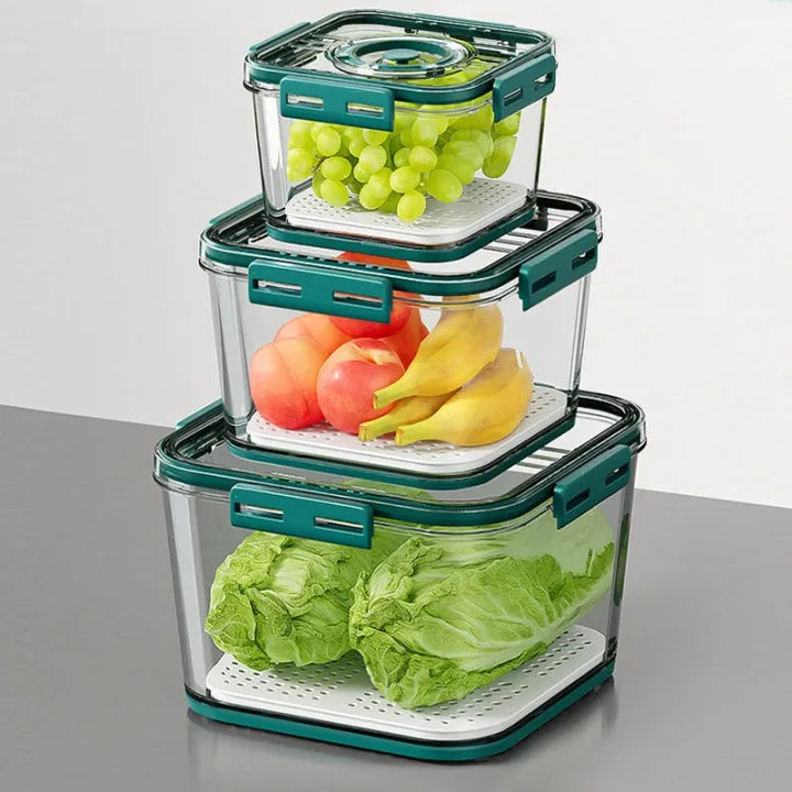 Three transparent plastic refrigerator storage containers of different sizes stacked neatly