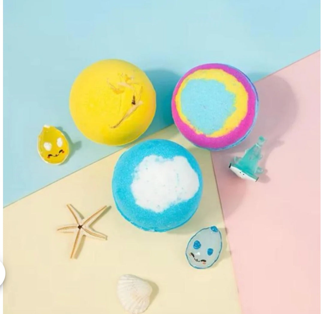 Three assorted colorful bath bomb spheres in a gift set