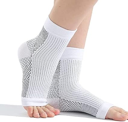 A pair of toeless black neuropathy compression socks on a foot