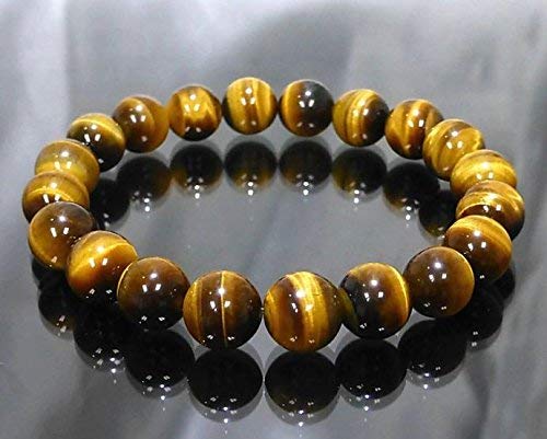 Tiger Eye stone bead bracelet in golden-brown tones on a plain background