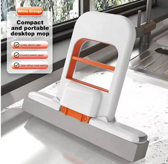 Mini foldable desktop mop in a retracted cleaning position