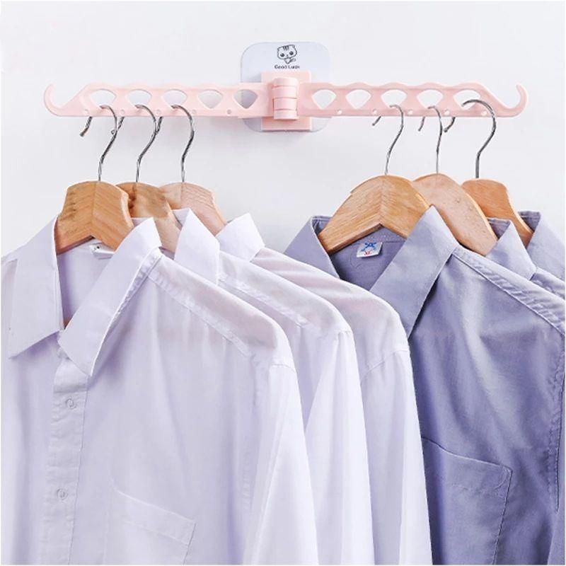 Multifunction clothing hanger featuring an integrated stand with clips for organizing small garments.