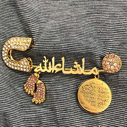 A brass Arabic-style brooch featuring intricate metalwork design