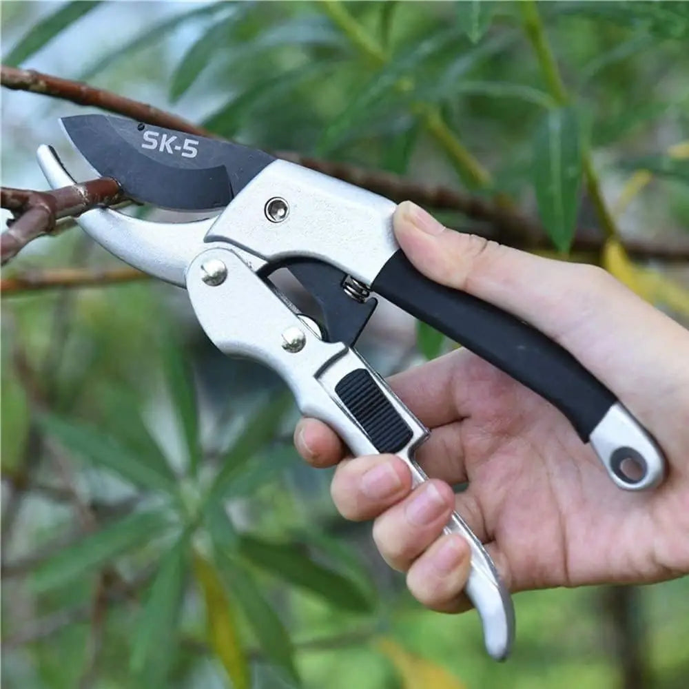 A pair of manual gardening pruning shears for plant trimming.