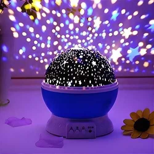 A round Star Master projection lamp casing showing star and moon cutouts with a USB cable.
