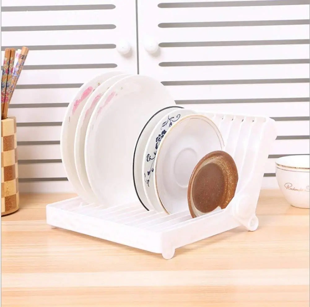 A folding plastic dish rack for kitchen countertops shown in an empty state.