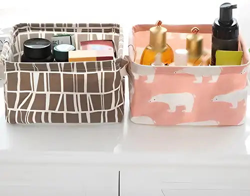 A pair of folding cotton linen storage bags in assorted colors shown empty