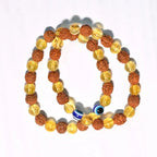Two Rudraksha and Citrine crystal bracelets displayed on a neutral background