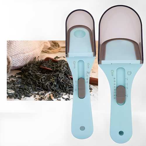 Two plastic measuring spoons placed on a kitchen surface