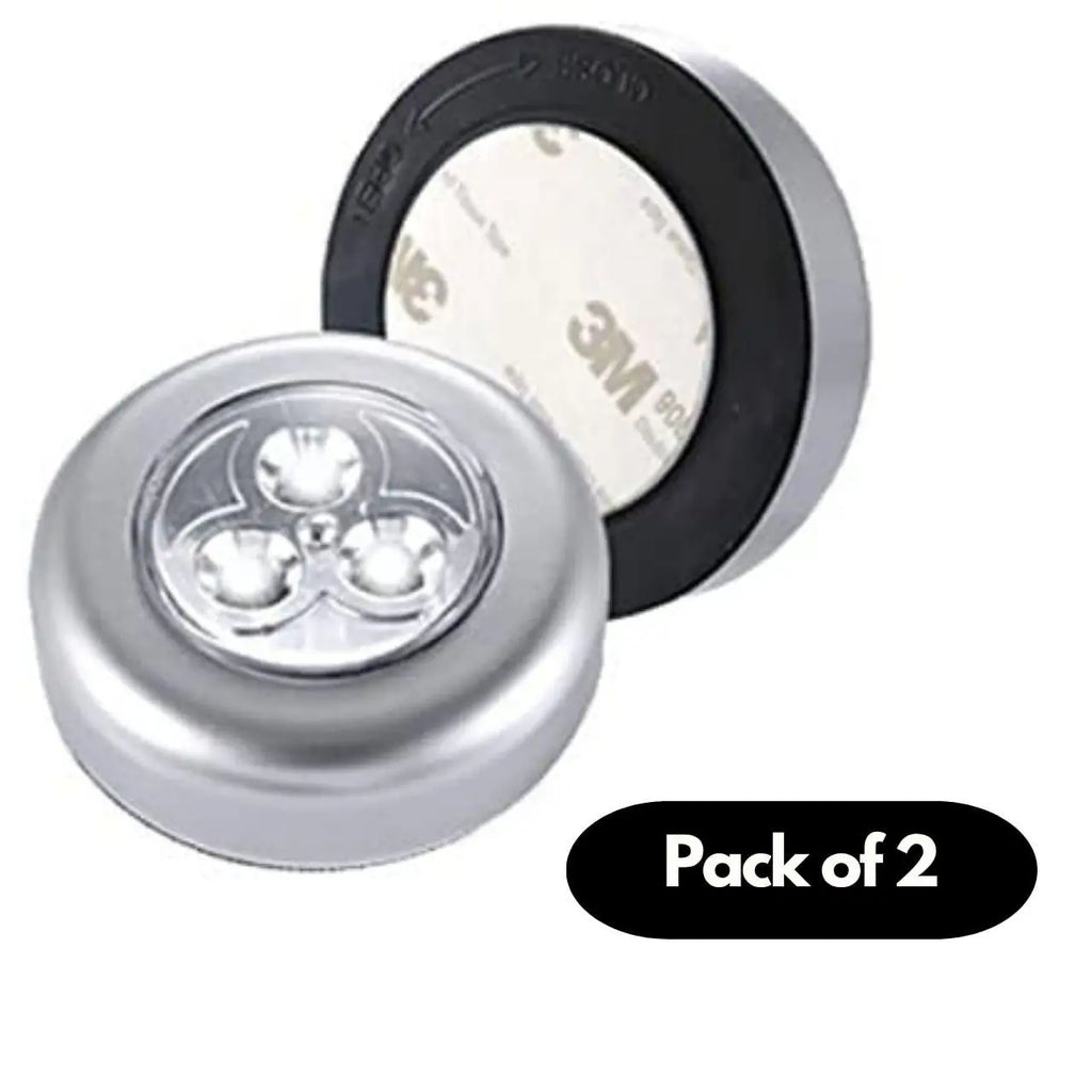 A set of two round stick-on touch lamps for interior cabinet lighting