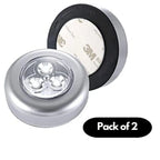 A set of two round stick-on touch lamps for interior cabinet lighting