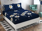 A neatly folded solid navy blue cotton double bed sheet.