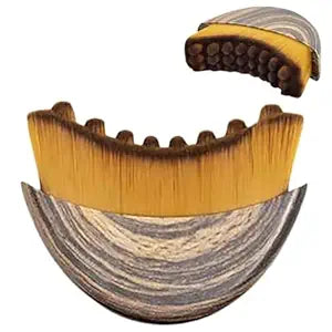 A plastic ergonomic lymphatic contour face brush with curved edges for facial massage