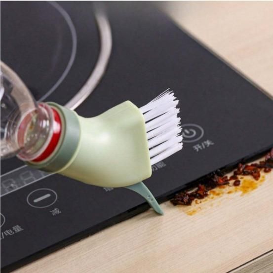 A standard plastic multi-use cleaning brush with a grip handle for household scrubbing