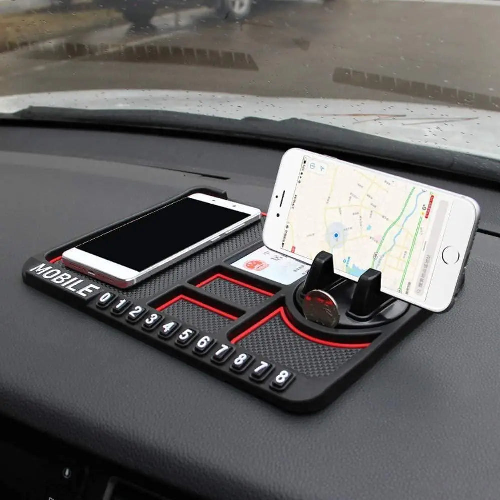 A black silicone dashboard pad with a built-in slot for holding a mobile phone in a car.