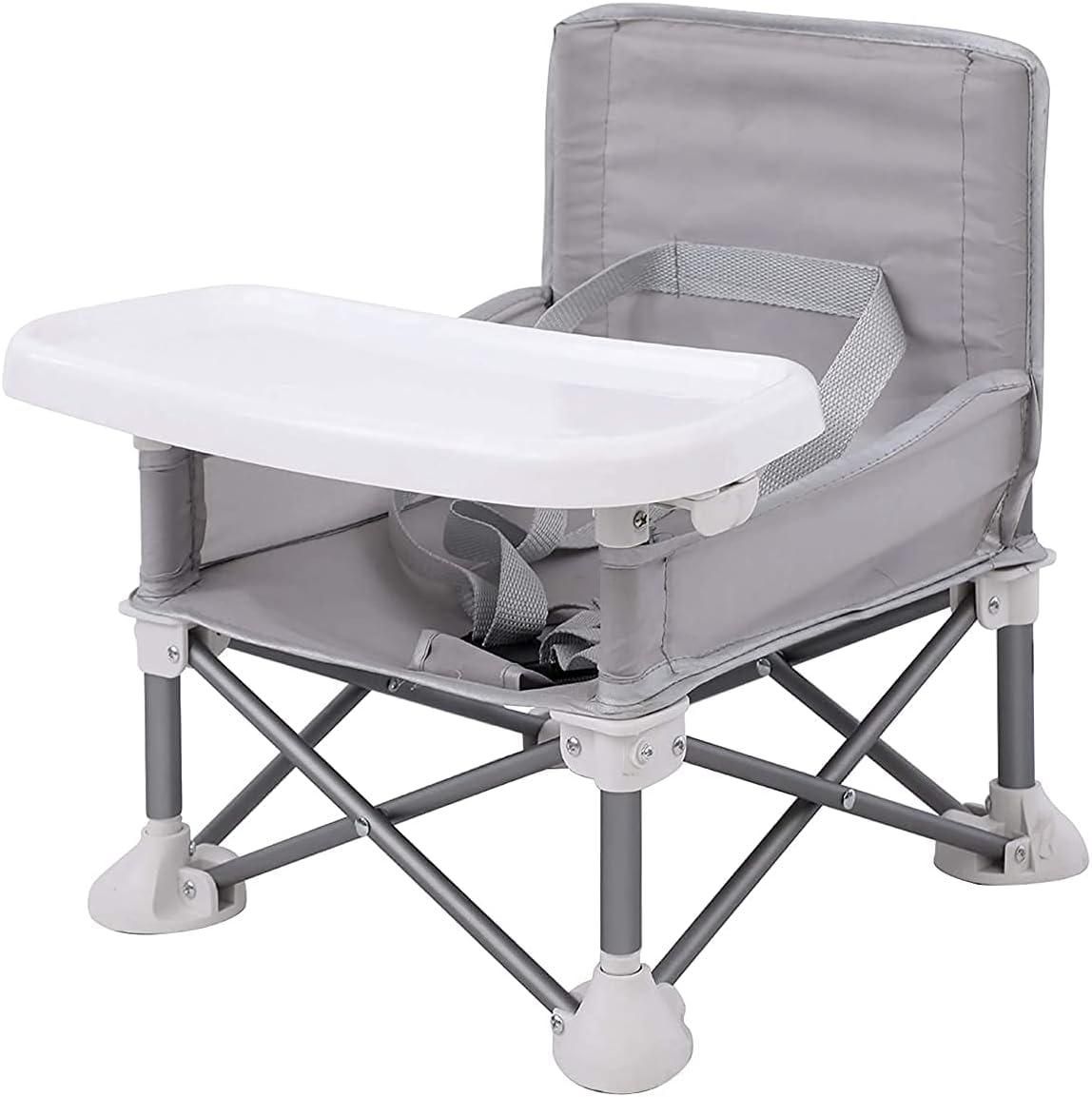 A folding portable plastic high chair with an attached tray for dining