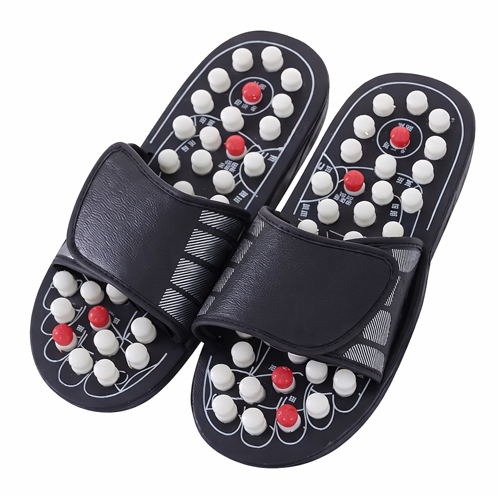 A pair of black acupressure massage slippers with an adjustable strap on the top.