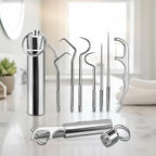 Seven-piece stainless steel dental cleaning tool set displayed on a flat surface