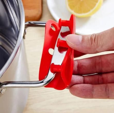 A close-up of a silicone pot handle holder designed for heat protection