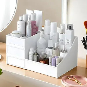 A clear plastic cosmetic storage box with 8 compartments for makeup and skincare.