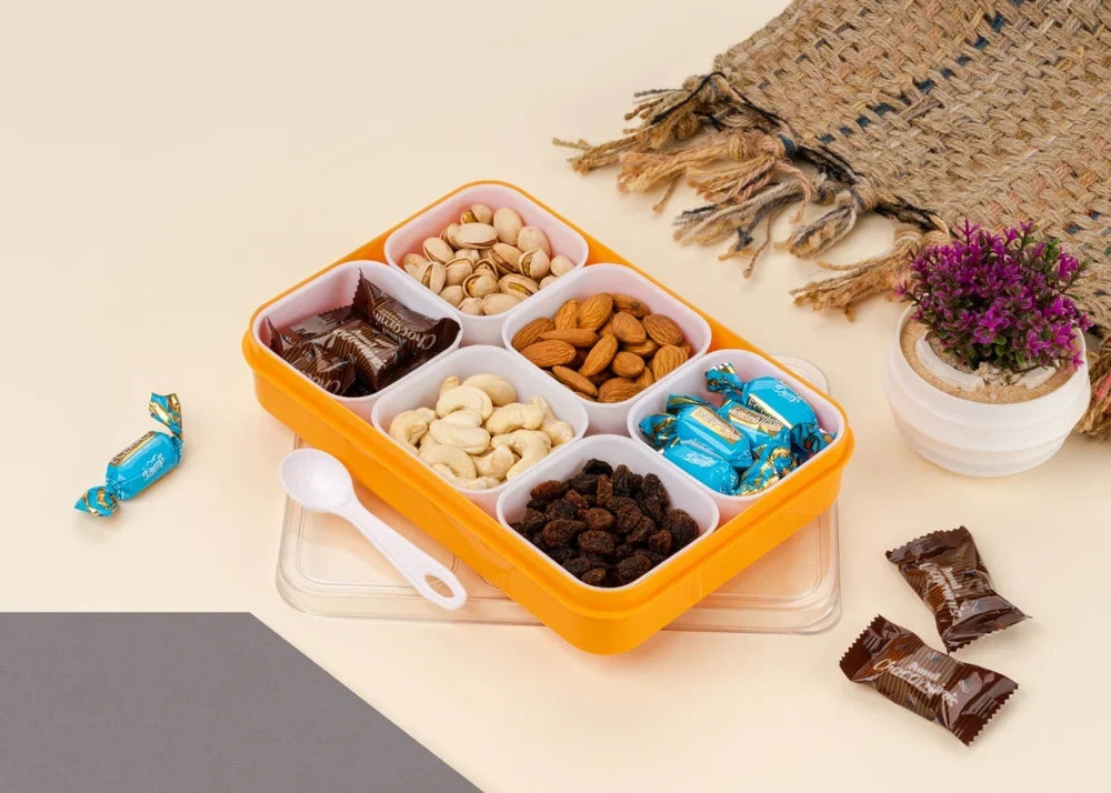 A 6-in-1 plastic masala box for kitchen spice storage including a small spoon