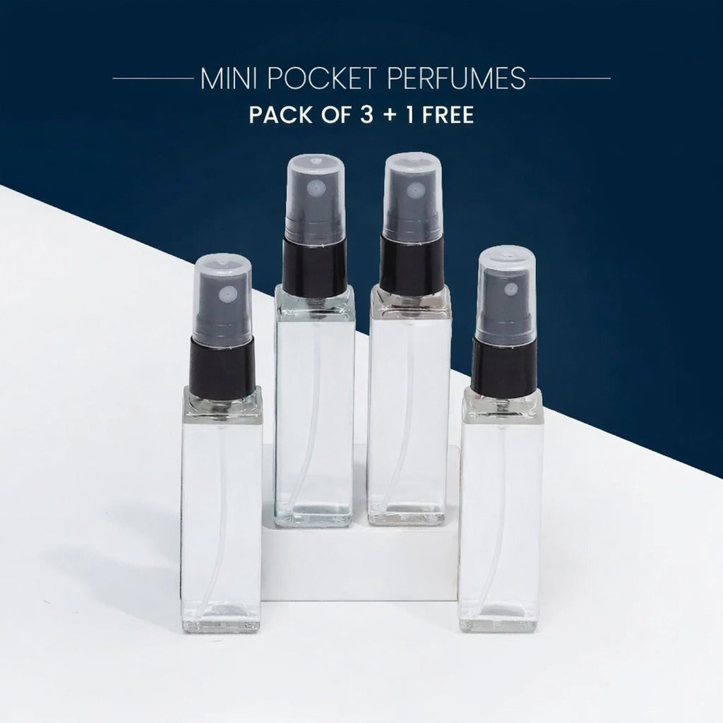 A set of four small pocket perfumes in compact spray bottles