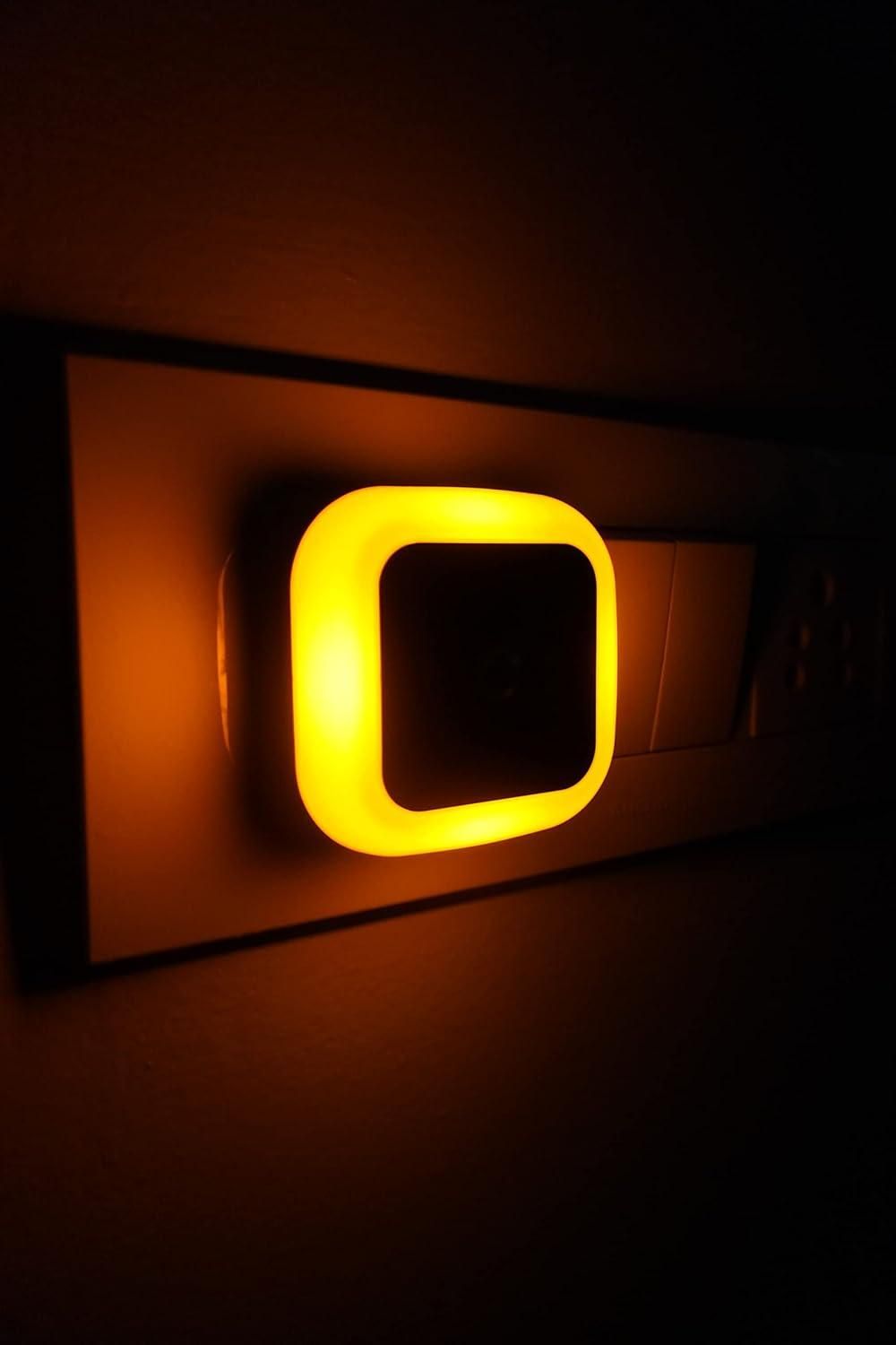 A small plug-in smart LED night lamp for bedroom or hallway use