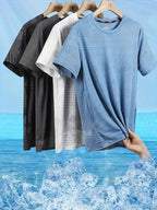 Four round neck t-shirts in sky blue, white, black, and grey colours folded neatly.
