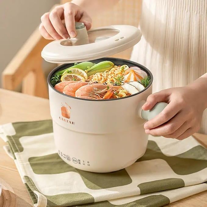 Electric mini cooking pot with 1.5L capacity and non-stick interior