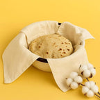 A plain cotton roti cloth folded and placed for serving warm flatbreads