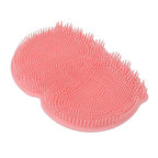 A close-up view of a silicone foot scrubber with textured bristles for shower exfoliation