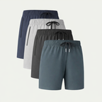 A set of four men's casual cotton shorts in various colours folded on a flat surface