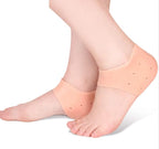 A pair of silicone gel heel protector socks for foot comfort