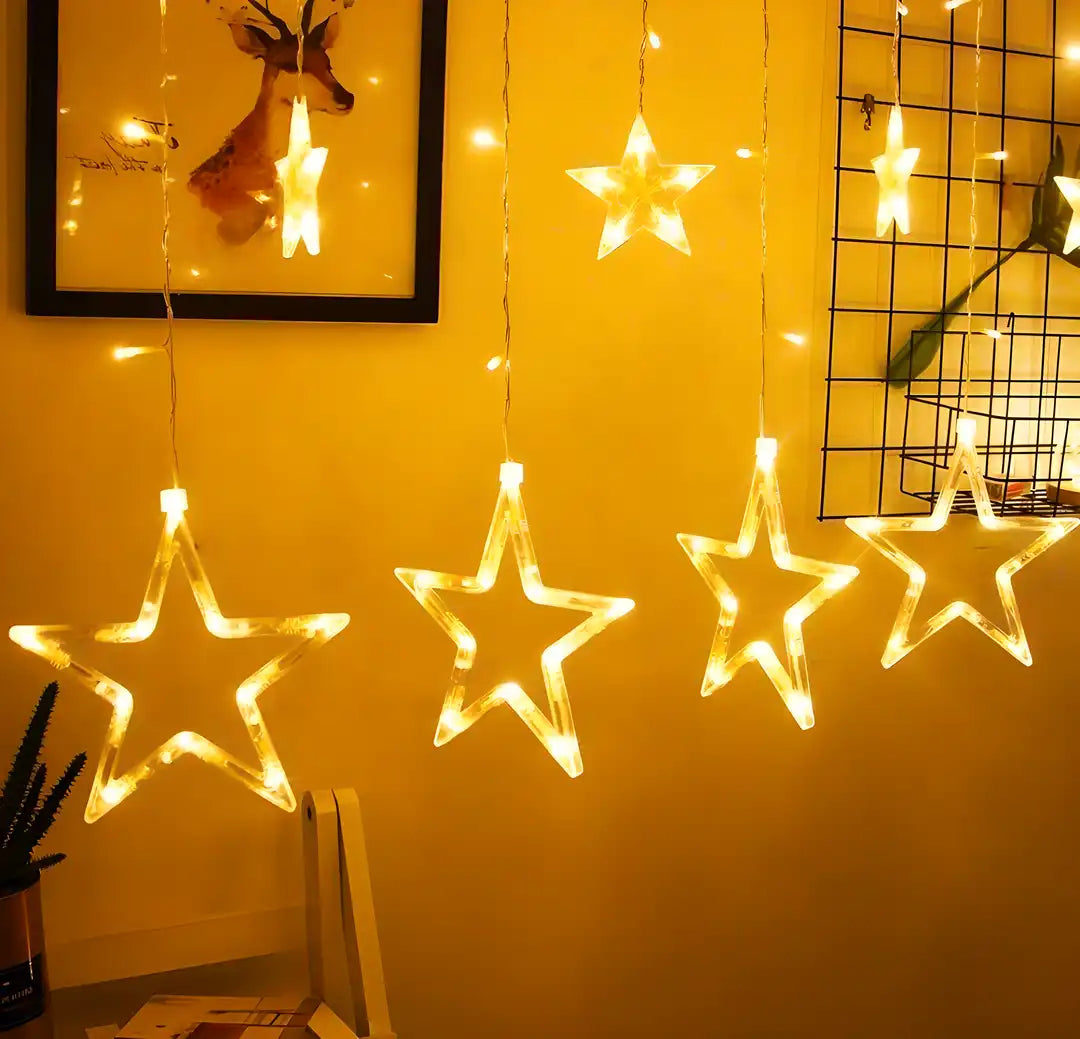 Decorative plastic star-shaped curtain lights hanging in a home