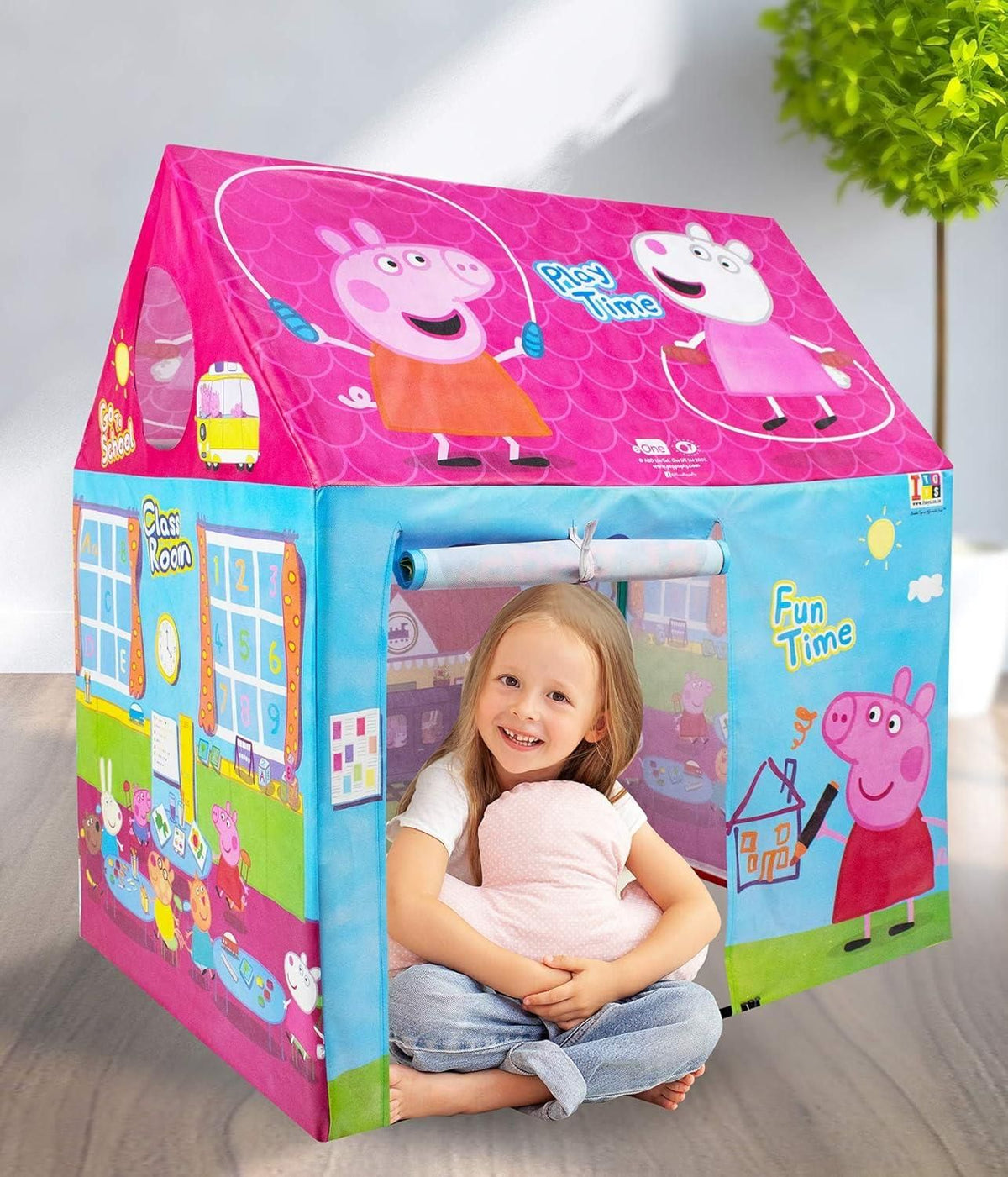 A colorful indoor tent house for kids set up in a living room for playtime