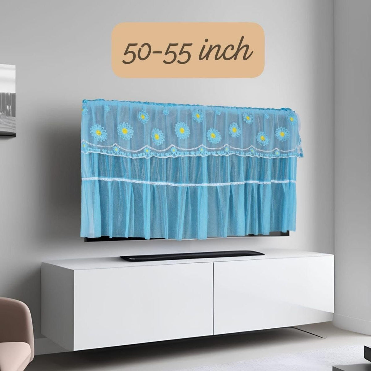 A colourful polyester dustproof cover draped over a flat screen LCD television